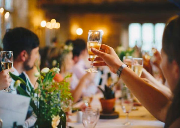 Raising a glass of champaign at a Wedding